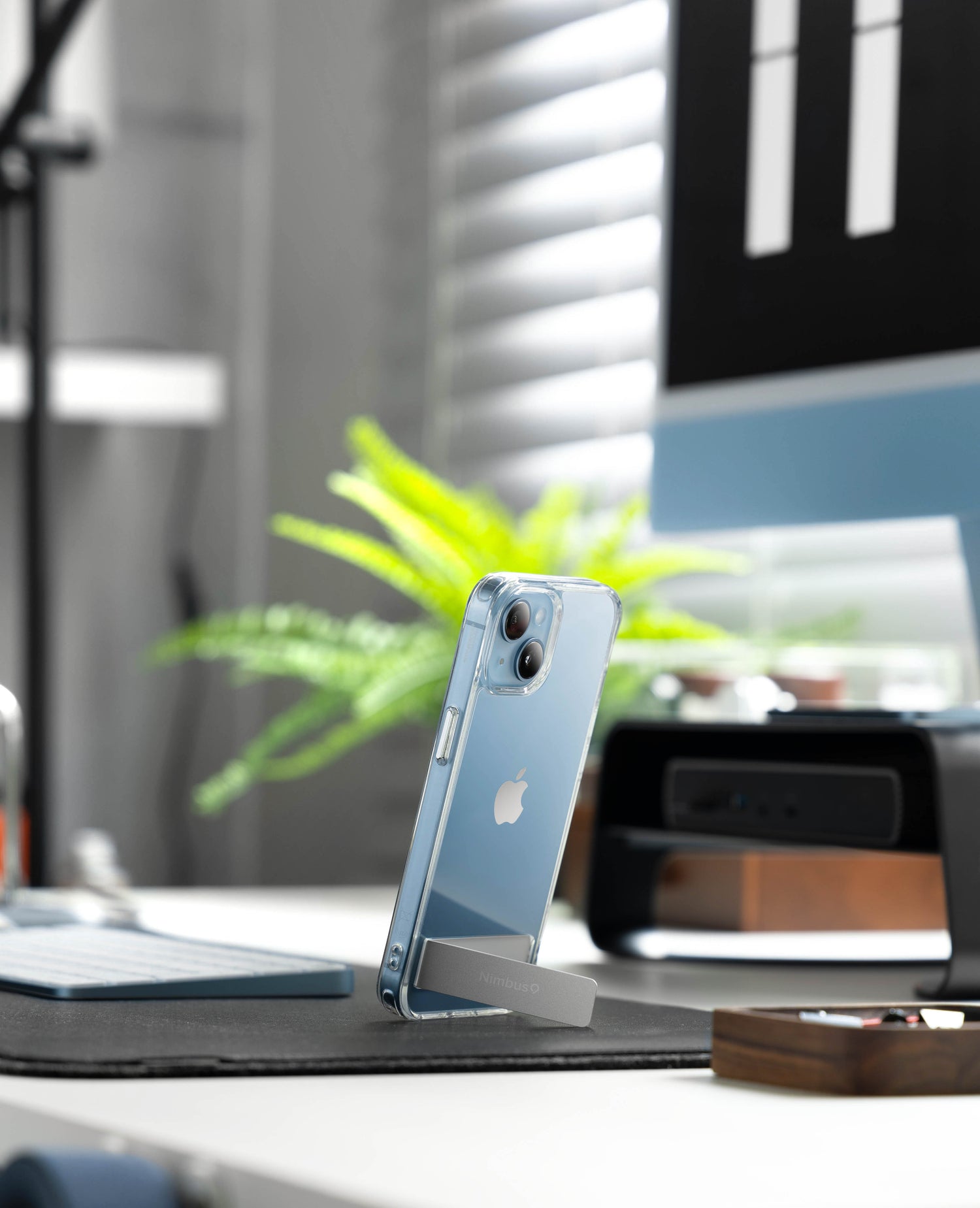 The Nimbus9 Aero case, a sleek and clear MagSafe-compatible design with a built-in metal kickstand. Perfect for hands-free viewing and ultimate device protection.