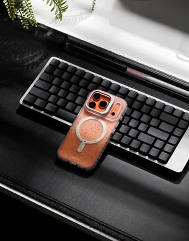 Stratus 2 case propped on a phone against a mechanical keyboard on a desk