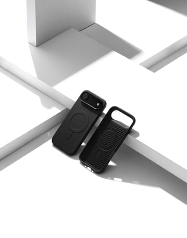 Two Nimbus9 Alto 2 cases in Black on a white geometric studio set — one fitted on a phone, one propped empty with its MagSafe ring showing