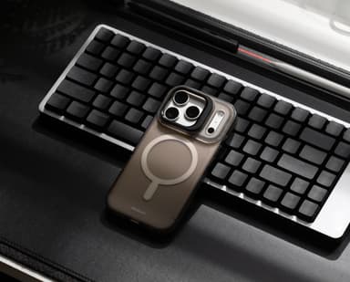 Stratus 2 case on a phone resting on a backlit keyboard beside a stylus