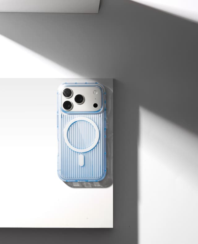 Nimbus9 Alto 2 Clear case in Clear Blue, ribbed sides catching the light, shot top-down on a white plinth